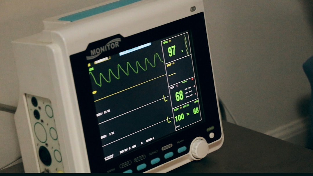 A person wearing a smart ring while sleeping, with a digital overlay showing temperature and heart rate data patterns used for early illness detection