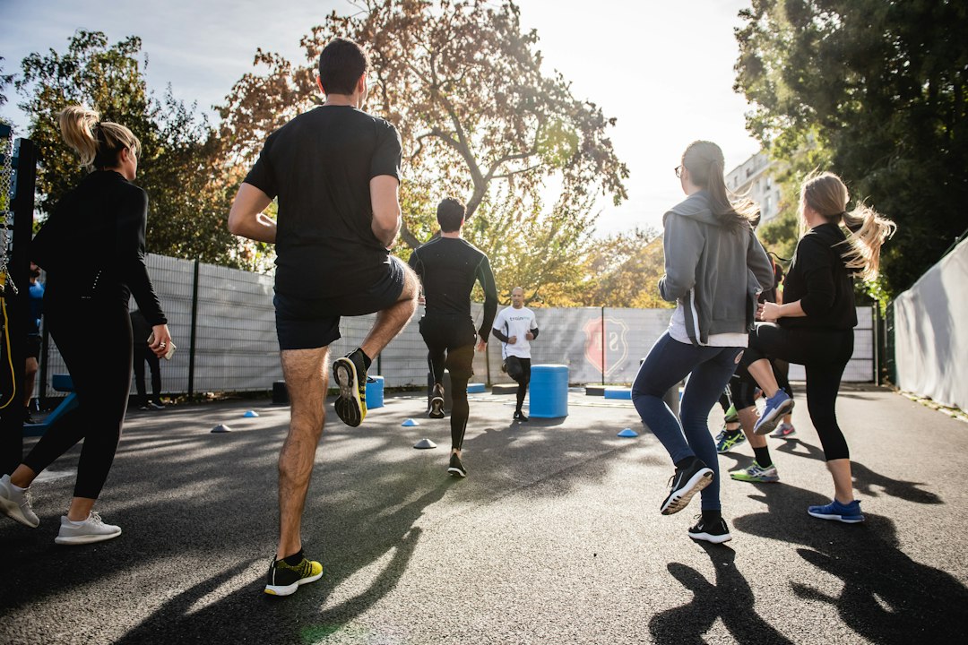 Runner on an empty road during daytime, illustrating daily cardiovascular load that recovery scores try to interpret