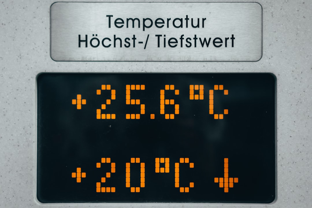 A close-up of a thermal temperature sensor showing body heat measurement, similar to how smart rings detect the thermal shift that signals ovulation