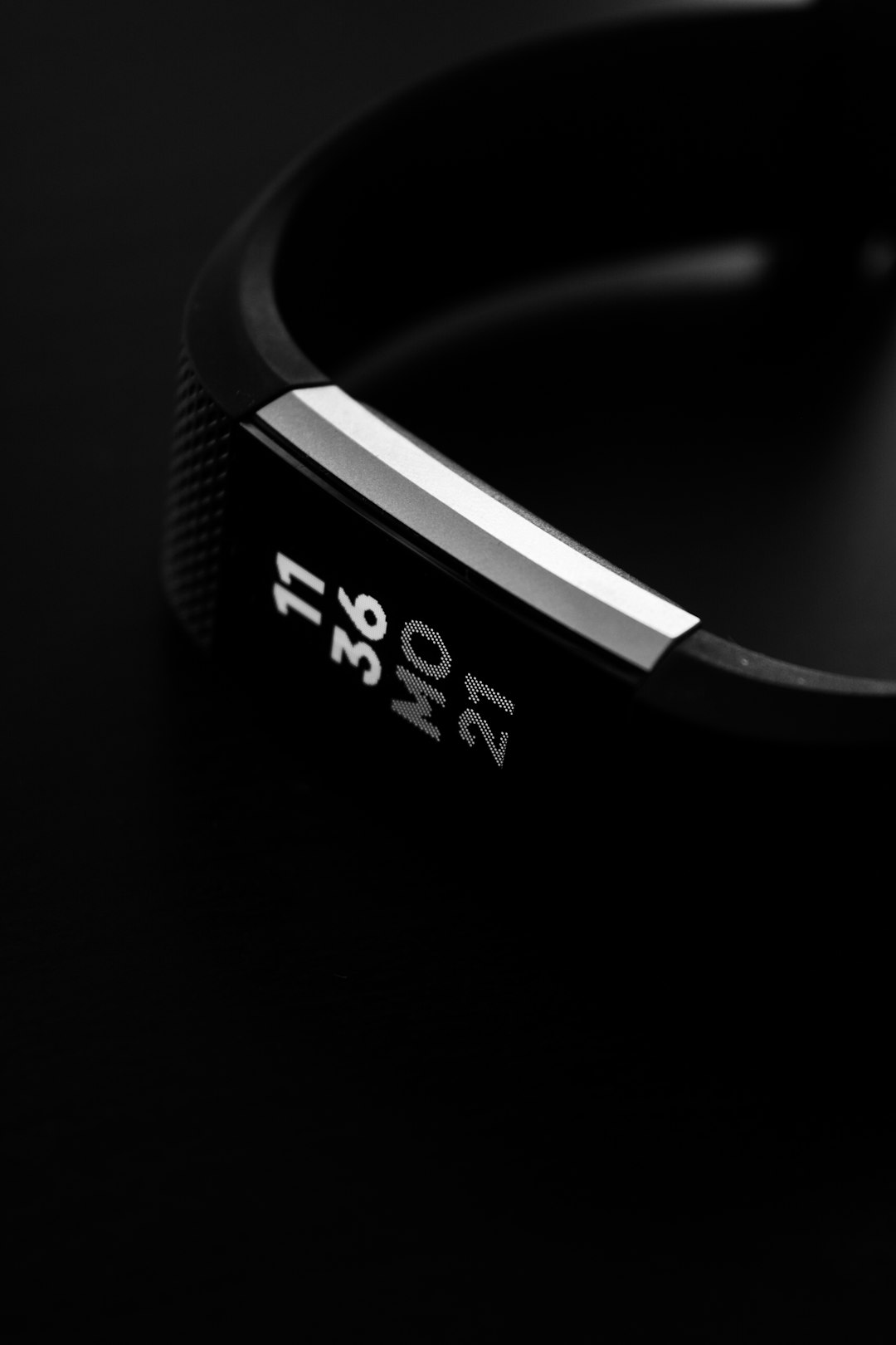 Wrist activity tracker display showing time and metrics in daily use