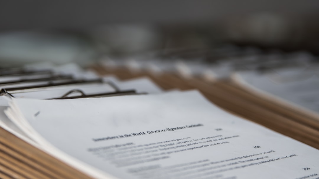A close-up of health insurance paperwork and documents, representing the entities that will seek access to continuous glucose monitoring data