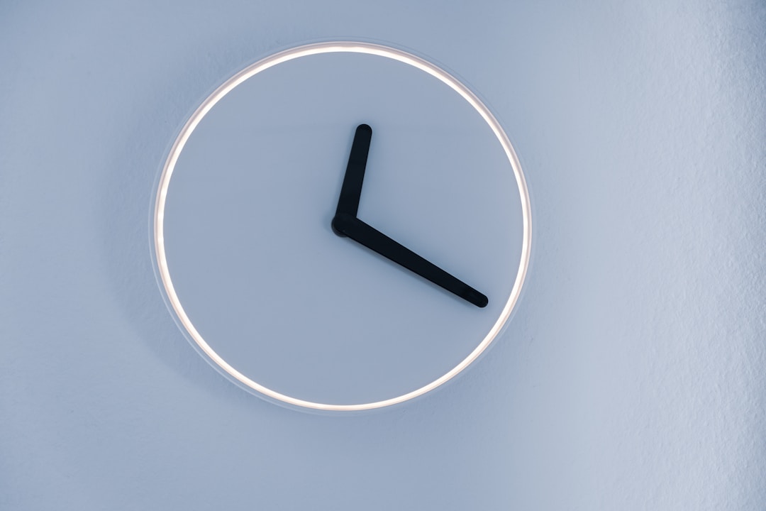 A clock face bathed in soft light, symbolizing the circadian rhythm that actually governs sleep: a system invisible to every accelerometer and heart rate sensor on the market