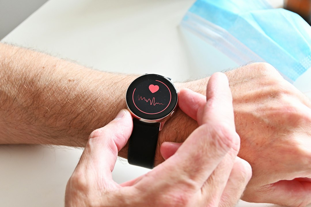 Wrist wearable displaying a heart rate readout during daytime activity, illustrating optical heart rate testing