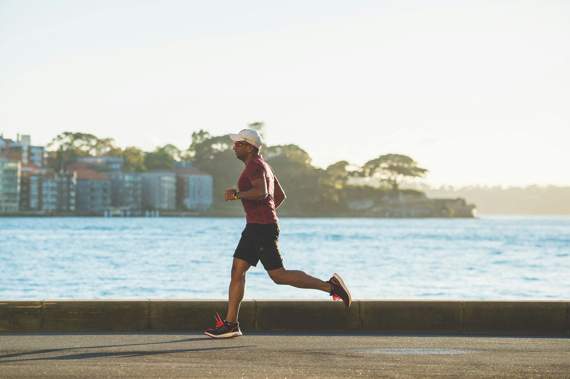 An athlete running at high effort, the kind of max exertion that a VO2 max lab test requires but wearables can only approximate through submaximal heart rate data