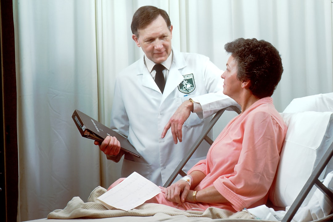 A doctor reviewing patient data on a tablet, illustrating the gap between consumer wearable metrics and clinical usefulness