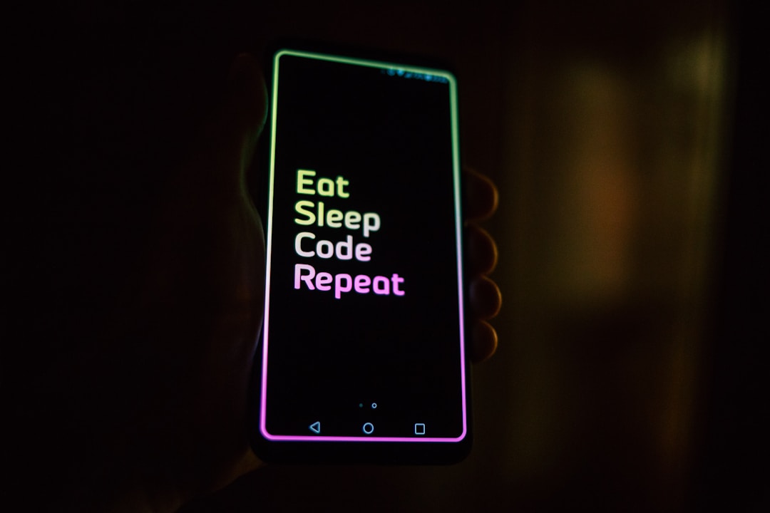 A smartphone screen showing a health tracking app in the dark, the exact kind of late-night data check that feeds orthosomnia anxiety